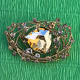 Brooch with a large golden crystal and a scattering of decorative stones (6704)