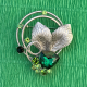 Brooch with a large green crystal and light green stones (6706)