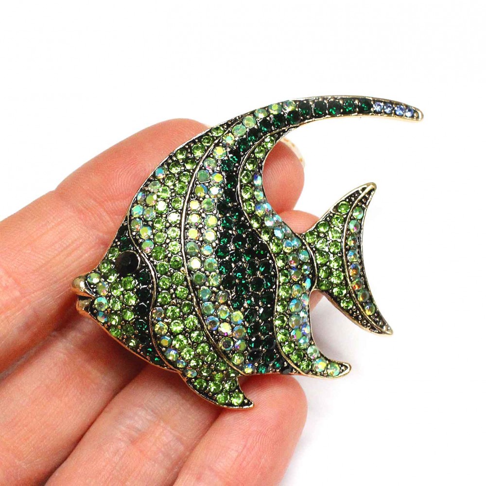Stylish fish-shaped brooch decorated with sparkling green rhinestones of various shades. (6502)
